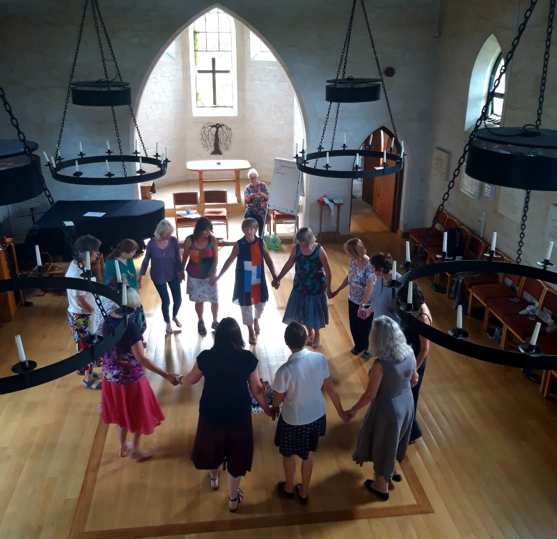 Circle dancers in the Othona chapel