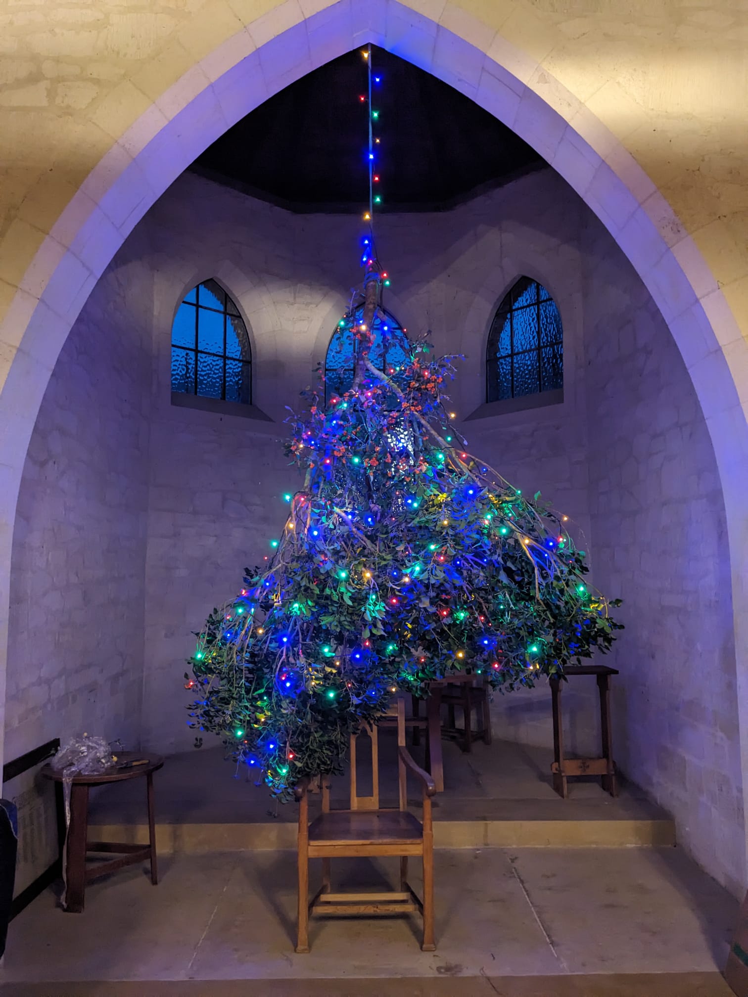 Christmas branches decorated and hung in the chancel arch at Othona West Dorset
